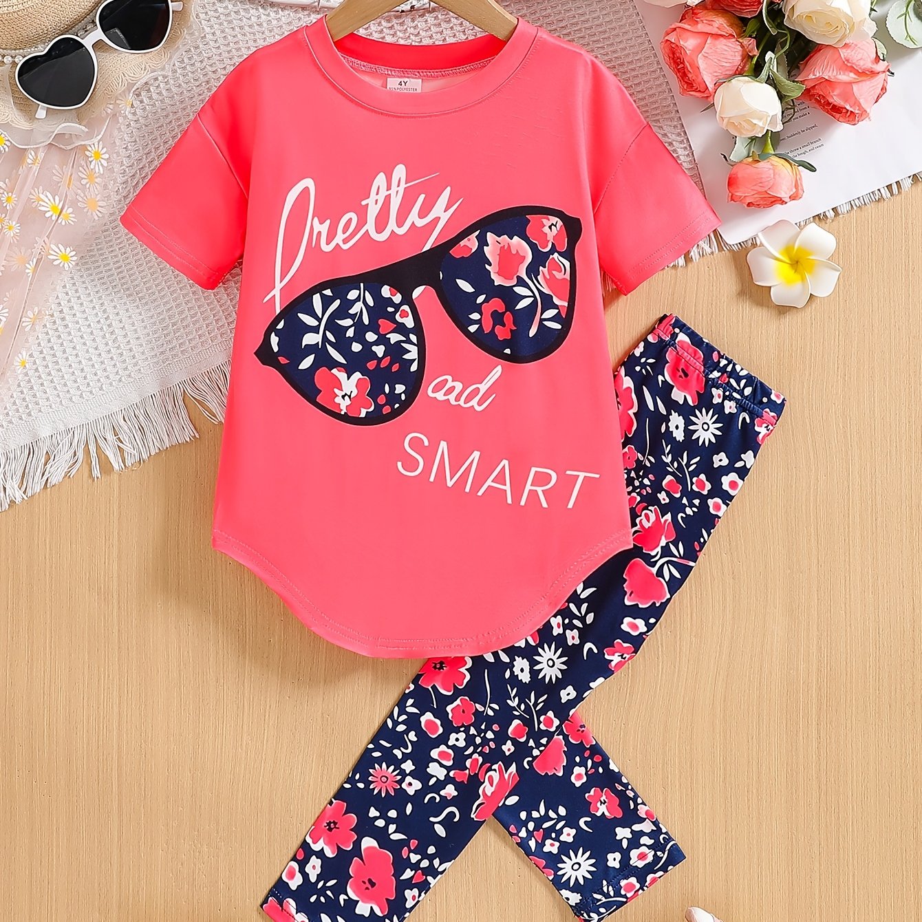 [Summer Outfit] 2pcs Girls' Summer Outfit | Large Glasses Print Pattern Drop Shoulder Irregular Hem Design Loose Short Sleeve T-Shirt + Floral Print Skinny Nine-Tenths Bottoms Set - Holiday Gift Girls' Fashion Casual Kids Sui